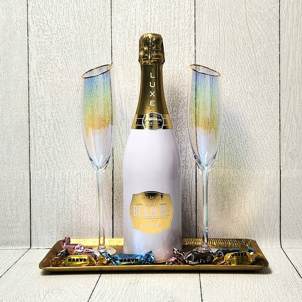 A Golden Toast champagne gift set with bubbly, gold-rimmed flutes and truffles
