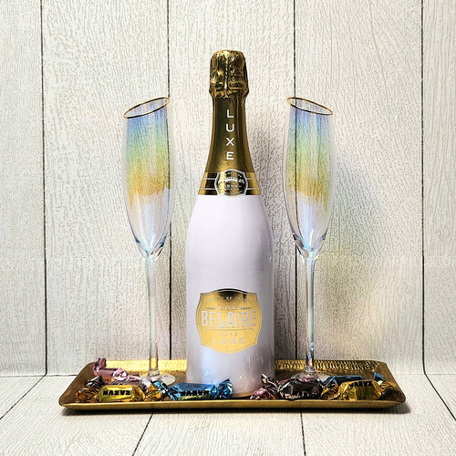 A Golden Toast champagne gift set with bubbly, gold-rimmed flutes and truffles